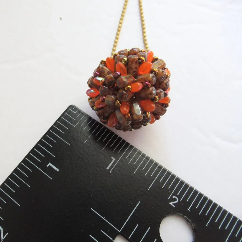 Handwoven Fall color beaded bead pendant